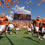 Clemson defensive tackle Tavaris Barnes (9), defensive back Martin Jenkins (14) and cornerback Garry Peters (26) run to the field before an NCAA college football game against Wake Forest, Saturday, Sept. 28, 2013, in Clemson, S.C. (AP Photo/Rainier Ehrhardt)
