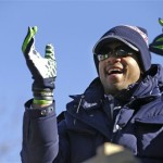 Seattle Seahawks quarterback Russell Wilson applauds fans during a parade for the NFL football Super Bowl champions Wednesday, Feb. 5, 2014, in Seattle. The Seahawks defeated the Denver Broncos 43-8 on Sunday. (AP Photo/Elaine Thompson)
