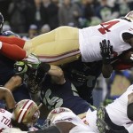  San Francisco 49ers' Anthony Dixon dives into the end zone for a touchdown run during the first half of the NFL football NFC Championship game against the Seattle Seahawks Sunday, Jan. 19, 2014, in Seattle. (AP Photo/Marcio Jose Sanchez)