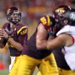 Arizona State quarterback Taylor Kelly, left, looks for an open receiver against Utah in the second quarter of an NCAA college football game Saturday, Sept. 22, 2012, in Tempe, Ariz. (AP Photo/Paul Connors)
