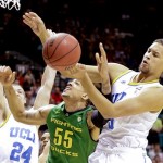 UCLA's Kyle Anderson, right, blocks a shot by Oregon's Tony Woods as Travis Wear (24) helps defend in the first half of the NCAA college basketball game in the Pac-12 Conference tournament, Saturday, March 16, 2013, in Las Vegas. (AP Photo/Julie Jacobson)
