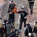 San Francisco Giants relief pitchers Sergio Romo, center left, and Brian Wilson, and center right, celebrate their baseball World Series win during a ticker-tape parade through downtown San Francisco, Wednesday, Nov. 3, 2010. The Giants defeated the Texas Rangers in five games for their first championship since the team moved west from New York 52 years ago. (AP Photo/Eric Risberg)
