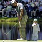 Aaron Baddeley of Australia's daughter Jewel watches as her father chips on a green during the Par 3 competition before the Masters golf tournament Wednesday, April 6, 2011, in Augusta, Ga. (AP Photo/Charlie Riedel)