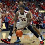  Arizona's Rondae Hollis-Jefferson (23) is pressured by California's Tyrone Wallace as he dribbles in the lane in the second half of an NCAA college basketball game on Wednesday, Feb. 26, 2014, in Tucson, Ariz. Arizona won 87-59. (AP Photo/John MIller)