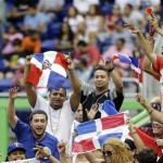 Dominican Republic fans cheer on their team against Italy during the World Baseball Classic game in Miami, Tuesday, March 12, 2013. The Dominican Republic won 5-4. (AP Photo/Alan Diaz)