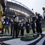  Referee Gene Steratore flips the coin before the NFL football NFC Championship game between the Seattle Seahawks and the San Francisco 49ers Sunday, Jan. 19, 2014, in Seattle. (AP Photo/Matt Slocum)