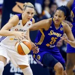 Phoenix Mercury's Penny Taylor battles Los Angeles Sparks' Marissa Coleman (25) for the ball during the first half of Game 2 of a WNBA basketball Western Conference semifinal series, Saturday, Sept. 21, 2013, in Phoenix. (AP Photo/Matt York)