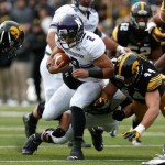  Iowa linebacker James Morris (44) hits Northwestern quarterback Kain Colter (2) during the first half of an NCAA college football game on Saturday, Oct. 26, 2013, in Iowa City, Iowa. (AP Photo/Brian Ray)