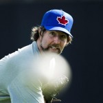 Toronto Blue Jays starting pitcher R.A. Dickey pitches as he warms up during baseball spring training in Dunedin, Fla., Monday, Feb. 11, 2013. (AP Photo/The Canadian Press, Nathan Denette)