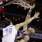 Phoenix Suns' Marcin Gortat, right, is fouled by Charlotte Bobcats' Byron Mullens, left, during the second half of an NBA basketball game in Charlotte, N.C., Wednesday, Nov. 7, 2012. Phoenix won 117-110. (AP Photo/Chuck Burton)