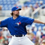 Toronto Blue Jays starting pitcher R.A. Dickey throws against the Boston Red Sox during the first inning of their exhibition spring training baseball game, Monday, Feb. 25, 2013, in Dunedin, Fla. (AP Photo/The Canadian Press, Nathan Denette)