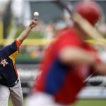 Houston Astros' Xavier Cedeno, left, pitches against Philadelphia Phillies' Michael Young during the second inning of an exhibition spring training baseball game, Saturday, Feb. 23, 2013, in Clearwater, in Fla. Houston won 8-3. (AP Photo/Matt Slocum)
