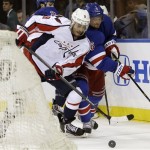 Washington Capitals center Mike Ribeiro (9) fends off New York Rangers defenseman Anton Stralman (6), of Sweden, in the first period of Game 3 of their first-round NHL hockey Stanley Cup playoff series in New York, Monday, May 6, 2013. (AP Photo/Kathy Willens)