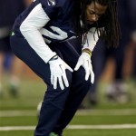 Seattle Seahawks cornerback Richard Sherman stretches as the start of NFL football practice Thursday, Jan. 30, 2014, in East Rutherford, N.J. The Seahawks and the Denver Broncos are scheduled to play in the Super Bowl XLVIII football game Sunday, Feb. 2, 2014. (AP Photo)