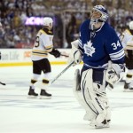 Toronto Maple Leafs goaltender James Reimer skates back on the ice as the Boston Bruins celebrate their empty-net goal during the third period of Game 3 of their first-round NHL hockey Stanley Cup playoff series, Monday, May 6, 2013, in Toronto. The Bruins won 5-2. (AP Photo/The Canadian Press, Frank Gunn)
