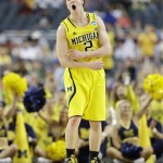 Michigan's Spike Albrecht (2) reacts against Florida during the second half of a regional final game in the NCAA college basketball tournament, Sunday, March 31, 2013, in Arlington, Texas. (AP Photo/Tony Gutierrez)