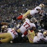  San Francisco 49ers' Anthony Dixon dives into the end zone for a touchdown run during the first half of the NFL football NFC Championship game against the Seattle Seahawks Sunday, Jan. 19, 2014, in Seattle. (AP Photo/Matt Slocum)