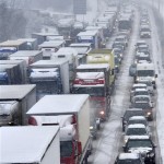 Cars line up on highway A 96 near Munich, Monday, Nov. 29, 2010. Heavy snowfalls caused accidents and traffic jams in Bavaria. (AP Photo/dapd/Lukas Barth)