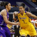 Los Angeles Sparks' Candace Parker, right, controls the ball as Phoenix Mercury's Candice Dupree, left, defends during the first half in Game 1 of their WNBA basketball Western Conference semifinal series on Thursday, Sept. 19, 2013, in Los Angeles. (AP Photo/Danny Moloshok)