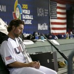 United States' R.A. Dickey sits in the dugout in the fourth inning during a World Baseball Classic baseball game against Mexico on Friday, March 8, 2013, in Phoenix. Mexico defeated the United States 5-2. (AP Photo/Ross D. Franklin)