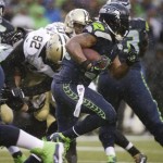 Seattle Seahawks running back Marshawn Lynch runs against the New Orleans Saints during the second quarter of an NFC divisional playoff NFL football game in Seattle, Saturday, Jan. 11, 2014. (AP Photo/John Froschauer)