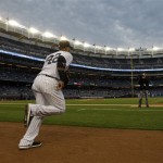New York Yankees second baseman Robinson Cano heads for his position before a baseball game at Yankee Stadium in New York, Tuesday, April 16, 2013. (AP Photo/Kathy Willens)