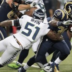 Seattle Seahawks outside linebacker Bruce Irvin (51) tackles St. Louis Rams running back Zac Stacy (30) during the first half of an NFL football game, Monday, Oct. 28, 2013, in St. Louis. (AP Photo/Tom Gannam)