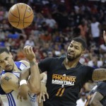 Golden State Warriors' Dwayne Jones, left, gets tangled up with Phoenix Suns' Markieff Morris battling for a rebound in the first quarter of the NBA Summer League championship game, Monday, July 22, 2013, in Las Vegas. (AP Photo/Julie Jacobson)