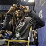 Seattle Seahawks' Richard Sherman takes a picture during media day for the NFL Super Bowl XLVIII football game Tuesday, Jan. 28, 2014, in Newark, N.J. (AP Photo/Jeff Roberson)