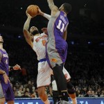 New York Knicks' Tyson Chandler, left, is fouled by Phoenix Suns' Markieff Morris in the first quarter of an NBA basketball game at Madison Square Garden in New York, Sunday, Dec. 2, 2012. (AP Photo/Henny Ray Abrams)