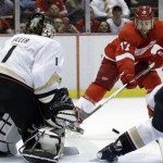 Anaheim Ducks goalie Jonas Hiller (1), of Switzerland, stops a Detroit Red Wings right wing Patrick Eaves (17) shot in the second period of Game 4 of a first-round NHL hockey Stanley Cup playoff series in Detroit, Monday, May 6, 2013. (AP Photo/Paul Sancya)