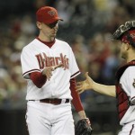 Arizona Diamondbacks' Brad Ziegler, left, shakes hands with catcher Miguel Montero after a baseball game win over the Pittsburgh Pirates Monday, April 16, 2012, in Phoenix. The Diamondbacks defeated the Pirates 5-1.(AP Photo/Ross D. Franklin