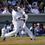 Chicago Cubs' Starlin Castro connects for a base hit against the Arizona Diamondbacks during the first inning of a spring training baseball game, Thursday, Feb. 27, 2014, in Mesa, Ariz. (AP Photo/Matt York)