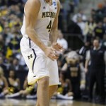 Michigan forward Mitch McGary (4) reacts after scoring against Virginia Commonwealth in the first half of a third-round game of the NCAA college basketball tournament Saturday, March 23, 2013, in Auburn Hills, Mich. (AP Photo/Duane Burleson)
