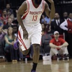 Houston Rockets guard James Harden (13) motions after hitting a three-point shot against the Portland Trail Blazers during the first half of an NBA basketball game, Monday, Jan. 20, 2014, in Houston. (AP Photo/Bob Levey)