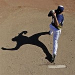 Milwaukee Brewers' Hiram Burgos throws before an exhibition spring training baseball game against the San Diego Padres, Monday, Feb. 25, 2013, in Phoenix. (AP Photo/Morry Gash)