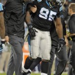 Carolina Panthers' Charles Johnson (95) is helped off the field after being injured against the New England Patriots during the second half of an NFL football game in Charlotte, N.C., Monday, Nov. 18, 2013. (AP Photo/Mike McCarn)