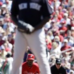 Philadelphia Phillies' Jimmy Rollins keeps an eye on New York Yankees pitcher Michael Pineda as Rollins takes a lead off first base in the first inning of a spring training baseball game, Monday, March 5, 2012, in Clearwater, Fla. (AP Photo/Matt Slocum)