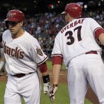 Arizona Diamondbacks' Miguel Montero, left, celebrates his run against the Pittsburgh Pirates with teammate Lyle Overbay (37) during the first inning of a baseball game Tuesday, April 17, 2012, in Phoenix. (AP Photo/Ross D. Franklin)