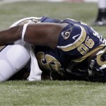  St. Louis Rams defensive tackle Michael Brockers reacts to an injury during the first quarter of a preseason NFL football game against the Baltimore Ravens Thursday, Aug. 30, 2012, in St. Louis. Brockers left the game. (AP Photo/Seth Perlman)