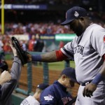 Boston Red Sox designated hitter David Ortiz, right, is greeted in the dugout after pulled from the game during the eighth inning of Game 5 of baseball's World Series against the St. Louis Cardinals Monday, Oct. 28, 2013, in St. Louis. (AP Photo/Matt Slocum)