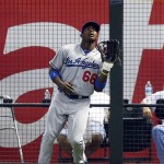 Los Angeles Dodgers right fielder Yasiel Puig (66) makes the catch in the first inning during a baseball game against the Arizona Diamondbacks on Monday, July 8, 2013, in Phoenix. (AP Photo/Rick Scuteri)