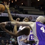 Charlotte Bobcats' Tyrus Thomas (12) is fouled by Phoenix Suns' Marcin Gortat (4) during the first half of an NBA basketball game in Charlotte, N.C., Wednesday, Nov. 7, 2012. (AP Photo/Chuck Burton)