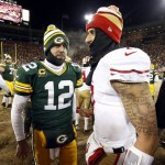  Green Bay Packers quarterback Aaron Rodgers (12) talks to San Francisco 49ers quarterback Colin Kaepernick (7) after an NFL wild-card playoff football game, Sunday, Jan. 5, 2014, in Green Bay, Wis. The 49ers won 23-20. (AP Photo/Mike Roemer)