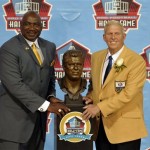 Inductee Bill Parcells, right, poses with his presenter George Martin, and a bust of himself during the induction ceremony at the Pro Football Hall of Fame Saturday, Aug. 3, 2013, in Canton, Ohio. (AP Photo/David Richard)
