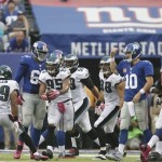 Philadelphia Eagles' Mychal Kendricks (95) celebrates with teammates after intercepting a pass from New York Giants quarterback Eli Manning (10) during the second half of an NFL football game Sunday, Oct. 6, 2013, in East Rutherford, N.J. (AP Photo/Kathy Willens)