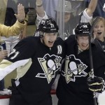 Pittsburgh Penguins' Evgeni Malkin (71) celebrates his goal with Beau Bennett (19) in the first period of Game 2 of an NHL hockey Stanley Cup first-round playoff series against the New York Islanders, Friday, May 3, 2013, in Pittsburgh. (AP Photo/Gene J. Puskar)
