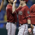 Arizona Diamondbacks' Paul Goldschmidt, right, high-fives teammate Eric Chavez after they defeated the Tampa Bay Rays 7-0 during an interleague baseball game on Wednesday, July 31, 2013, in St. Petersburg, Fla. Both players hit home runs in the win. (AP Photo/Chris O'Meara)