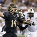 Baylor's Bryce Petty (14) gets off a pass as Central Florida's Miles Pace (44) is blocked during the first half of the Fiesta Bowl NCAA college football game Wednesday, Jan. 1, 2014, in Glendale, Ariz. (AP Photo/Ross D. Franklin)