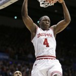 Indiana guard Victor Oladipo (4) dunks past James Madison guard Devon Moore in the first half of a second-round game at the NCAA college basketball tournament on Friday, March 22, 2013, in Dayton, Ohio. (AP Photo/Al Behrman)